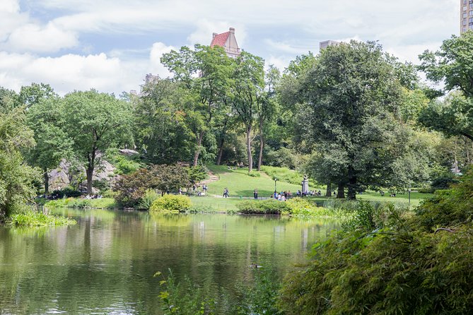 Central Park Guided Walking Tour - Architecture, sculptures, and the surrounding city in the background