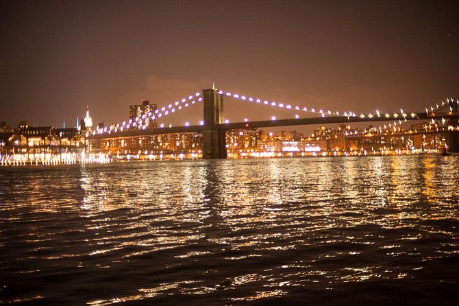 New York City Lights Cruise aboard Clipper City - Passing Under the Suspension Bridge: A Close-Up Moment