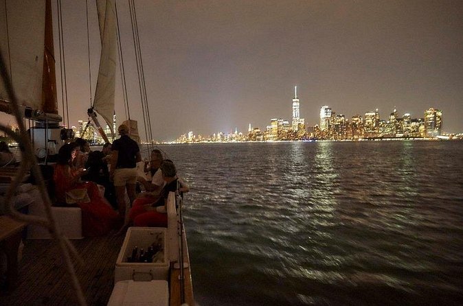 New York City Skyline Night Sailboat Tour - Passing Ellis Island: close enough to feel the scale