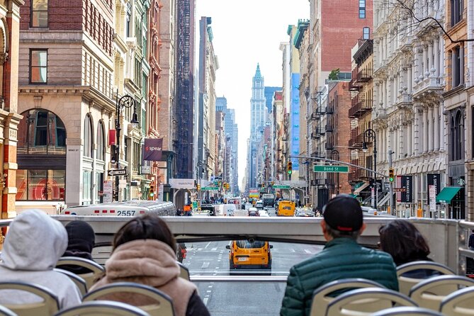 NYC Night Bus Sightseeing Tour with Free Statue of Liberty Cruise - Midtown highlights: Times Square, Empire State, Chrysler Building, Bryant Park, and Grand Central